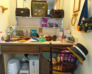 Purses, humidifiers and other things an old lady has in the bathroom
