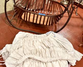 Antique wood cradle with bedding 
46” x 25” $250