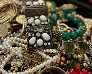 Trays of bangles, bracelets, necklaces, jewelry 