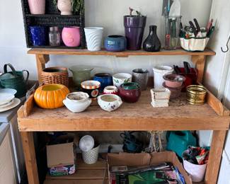 Pots, gardening items, flags, and a really nice rollable garden station!