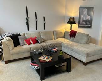 Lovely neutral sectional, coffee table, decor 