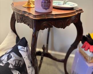 Antique table, candle, Elvis pillow