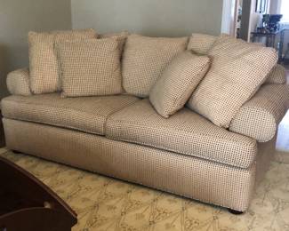 Custom-upholstered sofa with matching pillows