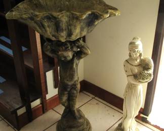 Angela angel holding shell, statue of woman