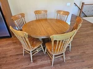 Charming Oak Pedestal Dining Table with Pressed Back Chairs