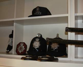 pair of British Bobby helmets, British police collectables, Police collectables