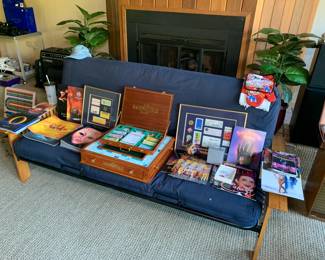 Las Vegas memorabilia including programs from shows (Cirque Du Soleil, Doug Henning Magic, Joel Grey, Jubilee) Framed artwork with casino chips, ticket stubs, and show tickets.