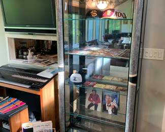 Display curio cabinet by Pulaski Furniture Corporation filled with many wonderful signed pieces. 