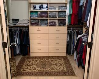 A master bedroom closet filled with TONS of brand new items including brands such as the Classics by Palmland, LD sport, Haggar, Jockey, Dockers, and various golf attire. 