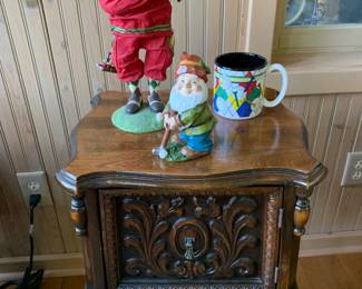 Ornate humidor side table used to store cigars. 