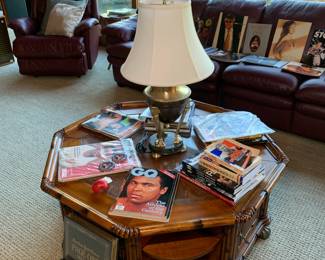 A coffee table filled with boxing magazines, books, and tributes to one of the greatest all time fighters Muhammad Ali.