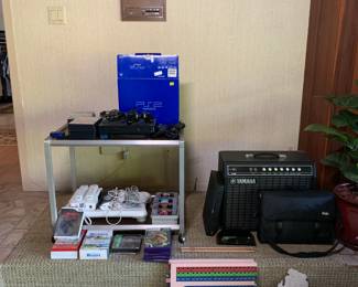 The video game station has 2 PS2 consoles (one in box), a   WII console, and video games from PlayStation 1, PlayStation 2, Wii, Gamecube, and Super Nintendo.