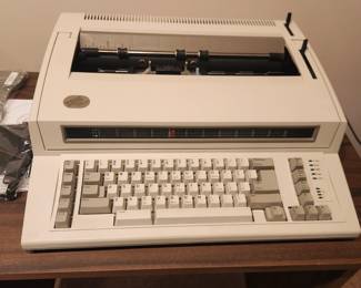 IBM Wheelwriter Typewriter with many backup ribbon, and original operator guide! Always covered with protective plastic. Excellent 