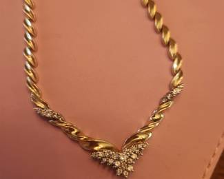 V Shaped 14k and diamond necklace 
Gold link necklace is substantial and heavy