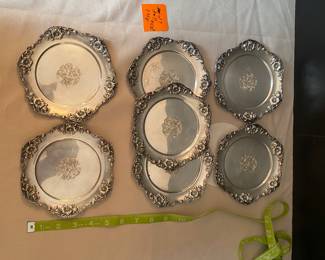 #7 - $500 - Set of 7 sterling bread and butter plates (matching previous lot) 