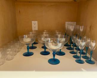 $400 Set of Venitian Blue stem/swirl glasses, 6 wine 6 Claret, 7 champagne and 10 Votivo.