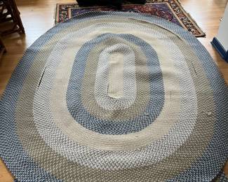 $150 Hooked oval rug 84x108 some areas need to be re-sawn