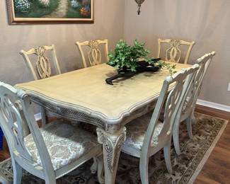 Ornate carving on legs and chair backs