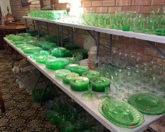 All the items on this table are uranium glass,  green underneath as well. We have a few Macbeth items that glow as well as a lamp, pink oil/vinegar bottle and cute tiny planter. 