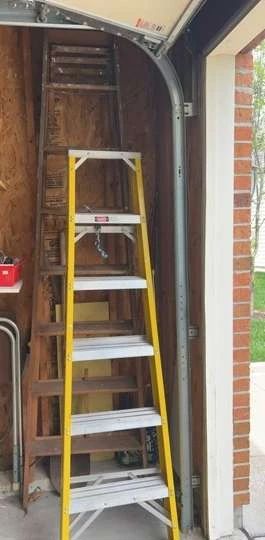 Two Ladders One Wood One aluminum