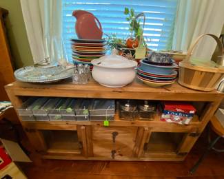 Rustic storage piece and assortment of Fiesta dishes 