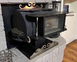Orley’s custom mid century modern wood burning fireplace insert stove/heater… really makes a place and helps the heating bill all winter… plus great for making tea!!