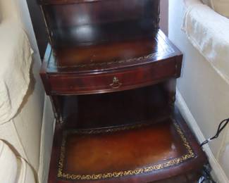 Tiered leather inlaid end table.
