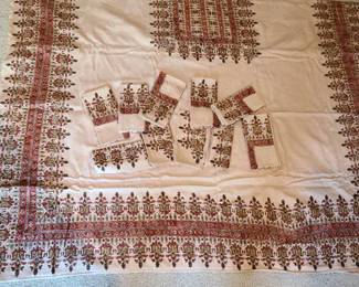 Beautiful tablecloth appx 64 x 98 inches and 10 napkins from Pakistan. The tablecloth is folded in half in pictures.