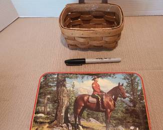 Vintage Rileys toffee tin with Canadian mountie on patrol and a small Longaberger basket with leather handle