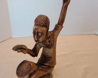 Hand carved wooden art 10 inches tall, signed.