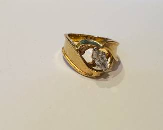 14 karat yellow gold with marquise-shaped .38 karat diamond in a white gold head section