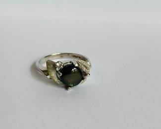 10 karat white gold ring with grayish/black stone and diamond
