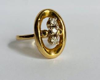 14 karat gold ring with three diamonds