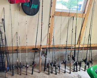 Many fishing rods and fishing tackle boxes