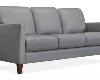 Purchased in 2020 for $900, two Macy sofas are available.

Highlight your contemporary taste in style at home with this handsome sofa. Track arms, an open base and stitched accents reflect its minimalist inspiration, presenting a subdued look that is incredibly fashionable and which is fit for almost any décor. Upholstered in smooth leather and with high density foam filled cushions, it presents a luxurious seat that is both supportive and comfortable. The perfect piece to elevate the appeal of your living space in both looks and feel.

- Removable legs
- Attached cushions
- Frame is constructed with hardwood that is dowelled and screwed with a Dacron wrap and webbing
- Seat cushions have high resilience 2.5 density foam with a Dacron wrap
- Back cushions have Dacron fiber
