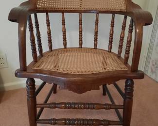 Antique Spindle Back Wood And Wicker Cane Chair With Carvings On Arms 
pic 1 of 3