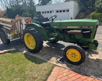 Vintage finely tuned John Deere Tractor plus mower deck, snow plow and trailer