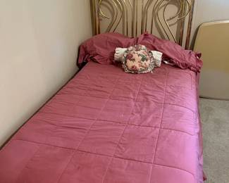 Twin brass bed with ceramic accents