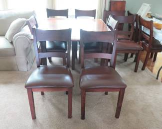 Table with 10 chairs,5 leaves and pads