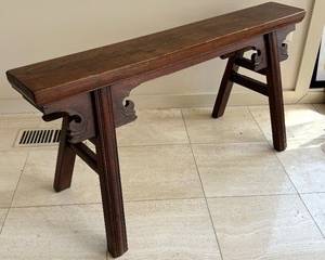 Antique Northern Elmwood Hebei Province, China Rectangular Slab Seat 

Bench, northern elmwood (yumu), Hebei province, northern China, 19th century or earlier; rectangular slab seat

Features four splayed legs – each recessed having bridle-joints and carved apron-head spandrels, side stretchers in pairs; Chinese calligraphy painted on underside, attached paper label ink inscribed: #196-14A / 18th C Chinese / Elm bench 

Measures 19 ½ inches high by 40 inches long.