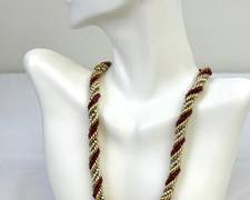 Vintage 14k, Ruby and Pearl Intertwined Gorgeous Necklace 

Such a beautiful design, measures 15.5 inches long 

Weight: 84.5 grams. 