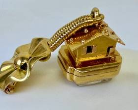 Vintage Bucherer 14k Watch Pin featuring an adorable house figurine. 

Item not tested. 