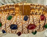 Beatiful Vintage CINER Gold Tone Multi Colored Cabochon Bracelet 

Measuring about seven inches long. Missing some cabochons. 