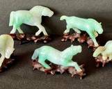 Five Miniature Carved Jade Horse Figurines with Stands 

Each Measures about 2.25" x 1.5" (without the stand) 

The stands are included. Two of the figurines are chipped.