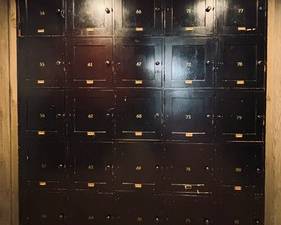  Set of Antique Prohibition Era Storage Lockers from the Woodhill Country Club. 

A unique and rare find! So much history in these lockers, if only they could speak and tell us some stories! The lockers still contain the names of prominent individuals on the locker doors! 

This block of Antique Storage Lockers measures 75 x 81 x 16 inches.