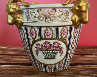 19th century Dresden porcelain cachepot, decorated with flowers and rams’ heads. To see all 200+ pictures, visit https://www.sophiasestatesales.com/current-estate-sales and click on the link.