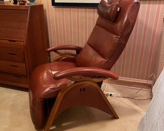 Andrew LeBlanc brown leather and wood recliner, very modern and elegant, sleek design, not  so bulky