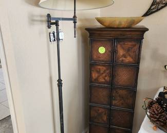 Swing-arm floor lamp and unique bamboo cabinet