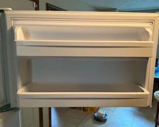 Door for top freezer section of refrigerator in kitchen