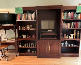 Entertainment center in living room - Has Hummel figurines - books and other collectibles - TV also for sale